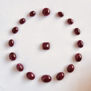 Natural ruby oval cabochon loose gemstones arranged in circular layout