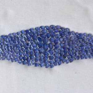 Natural Burmese blue sapphire oval loose gemstones arranged in a layout