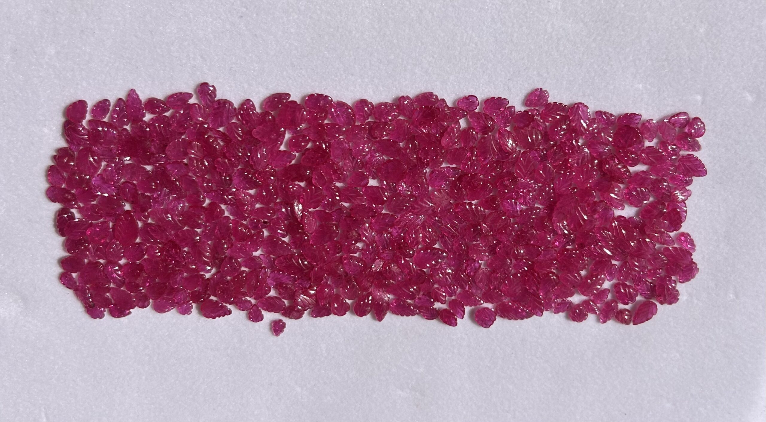 Natural ruby leaf carving loose gemstones in vibrant pinkish red color