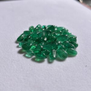 Natural emerald tumble loose gemstones in rich green tones